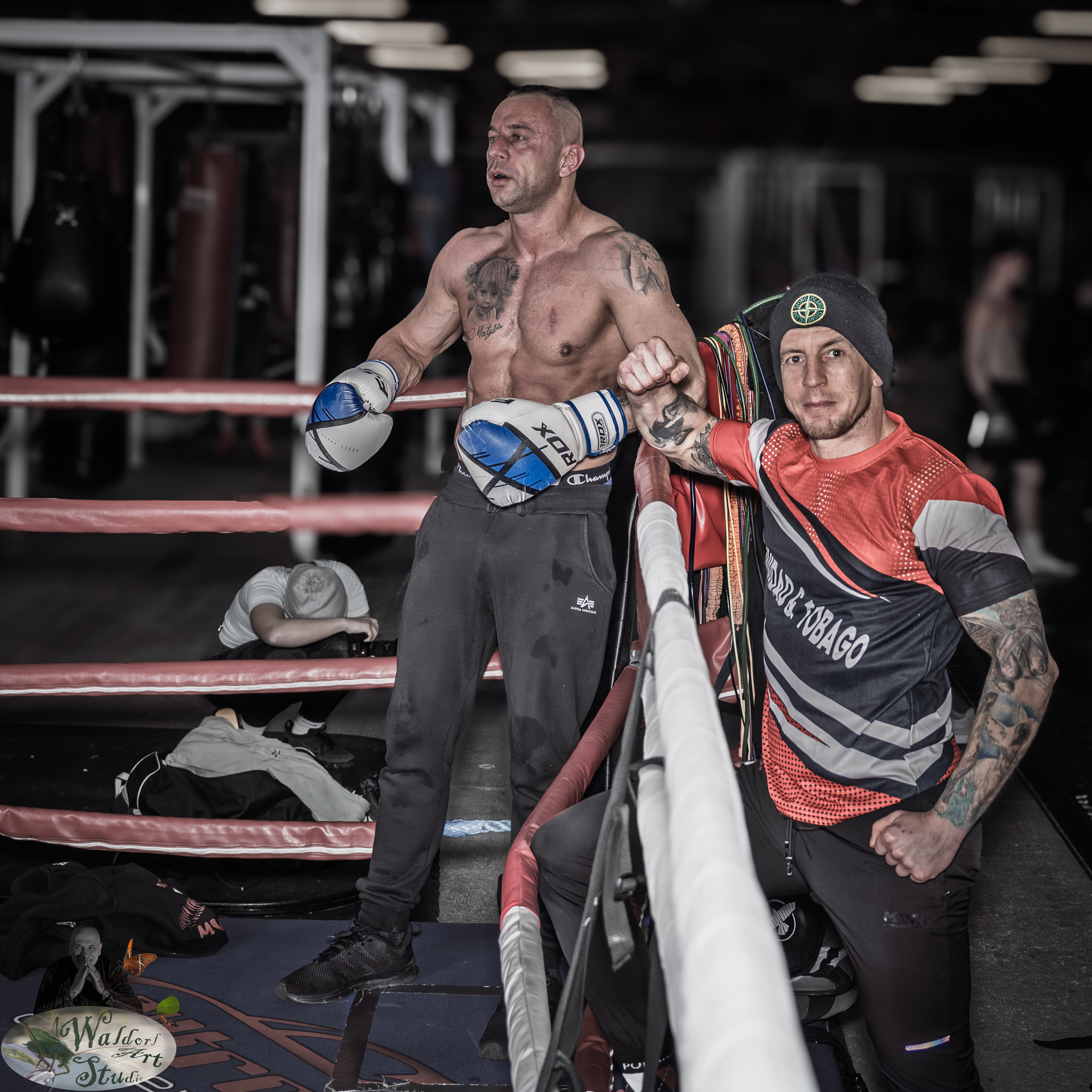 Jasiek and his coach Bart - Sęku standing by the boxing ring after an intense training session.